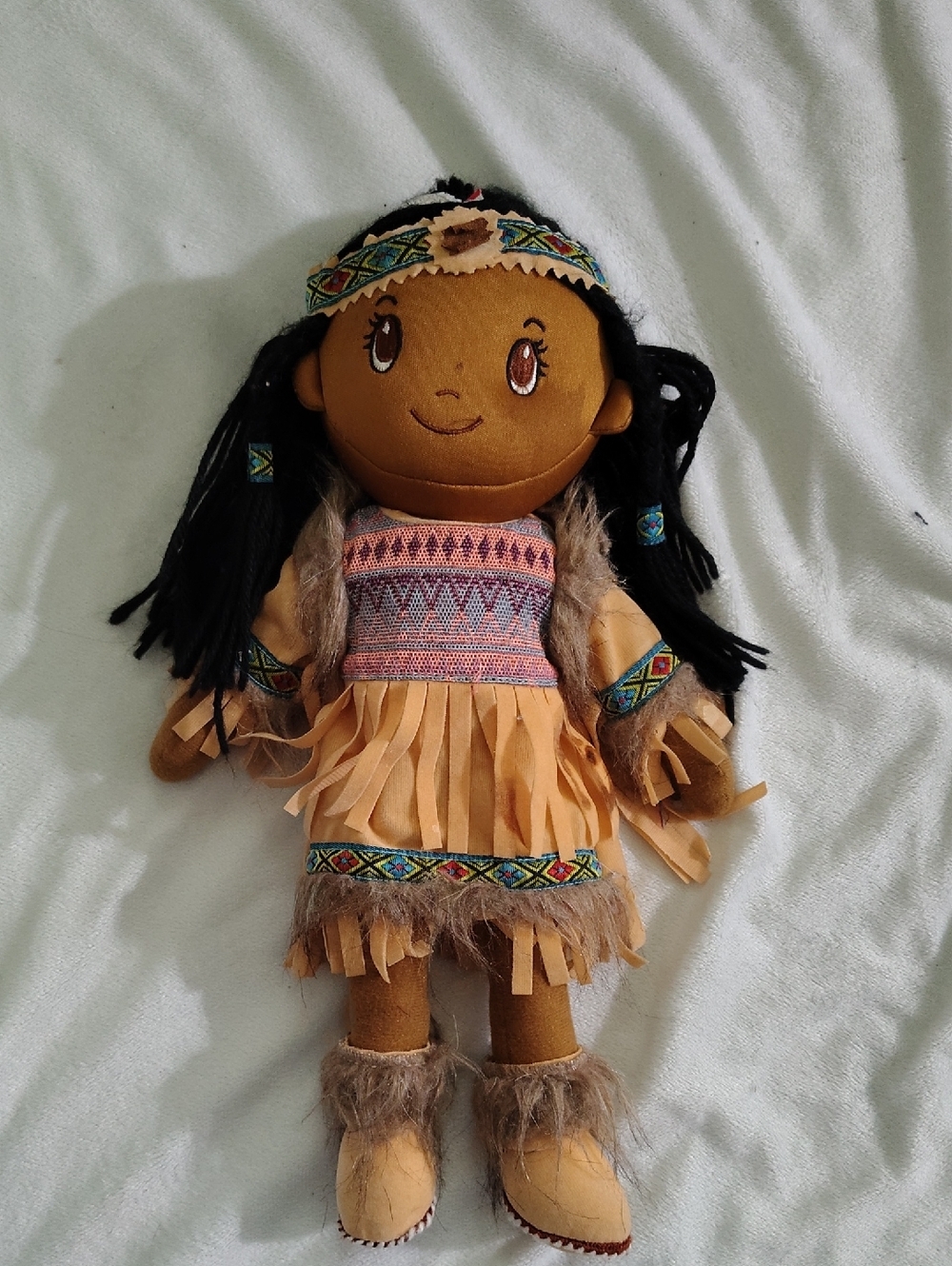 Tan Plush Fringe Doll with Black Hair and Patterned Trim